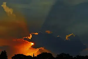 Winnipeg Prints: Canada, Manitoba, Winnipeg. Crepuscular rays or God rays at sunset