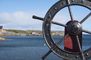 Canada, Newfoundland and Labrador, Twillingate. Fishermans Point, boat wheel