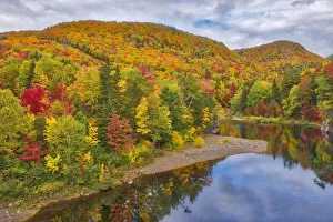 Canada, Nova Scotia. Indian Brook and forest in autumn. Credit as