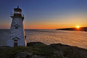 Canada, Nova Scotia, Long Island. Boars Head Lighthouse at sunrise. Credit as