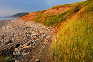 Images Dated 29th July 2009: Canada, Nova Scotia, Pleasant Bay. Red cliffs at sunset on Cabot Trail. Credit as