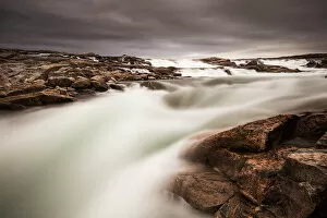 Nunavut Gallery: Canada, Nunavut Territory, Blurred image of rushing waterfall near Bury Cove along
