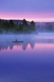 Contemplation Prints: Canada, Ontario, Algonguin Park, Canoeist on lake at sunrise. Credit as: Nancy Rotenberg