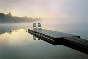 Canada, Ontario, Algonquin Provincial Park, Chairs on dock. Credit as: Nancy Rotenberg Canada, Ontario, Algonquin Provincial Park, Chairs on dock. Credit as: Nancy Rotenberg