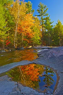 Canada, Ontario. Fall reflections on Rosseau River at Lower Rosseau Falls. Credit as