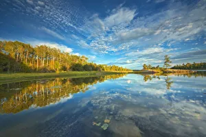 Images Dated 31st March 2018: Canada, Ontario, Kenora. Clouds reflected in Middle Lake at sunset