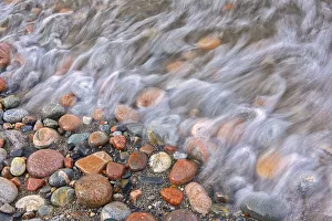 Images Dated 31st March 2018: Canada, Ontario, Marathon. Rocks and driftwood on Pebble Lake Superiors Beach