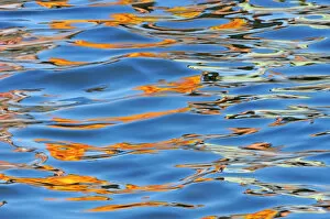 Canada, Ontario, Port Carling. Detail of yellow boat reflected in Lake Rosseau. Credit as