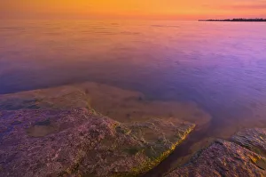Ontario Prints: Canada, Ontario, Selkirk. Morning light on rocky shoreline of Lake Erie