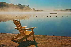 Images Dated 23rd May 2022: Canada, Ontario, Silent Lake Provincial Park. Muskoka chair and morning fog on Silent Lake