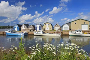 Images Dated 19th July 2009: Canada, Prince Edward Island, New London. Fishing boats and sheds in coastal village