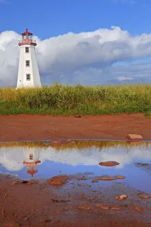 North Cape Prints: Canada, Prince Edward Island, North Cape. North Point Lighthouse reflects in pool