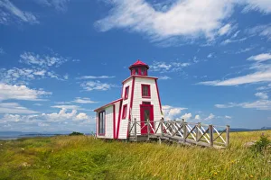 Prints of Canada, Quebec, Kamouraska. Lighthouse on shore of St. Lawrence River. Credit as: Mike Grandmaison / Jaynes Gallery / DanitaDelimont.com Images Dated 2020 March: Canada, Quebec, Kamouraska. Lighthouse on shore of St. Lawrence River