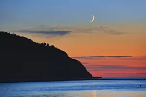 Crescent Prints: Canada, Quebec, Mont-Louis. Crescent moon sunrise on Gulf of St. Lawrence