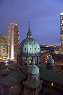 Images Dated 4th December 2009: Canada, Quebec, Montreal. Night view of Cathedrale Marie-Reine-du-Monde and downtown Montreral