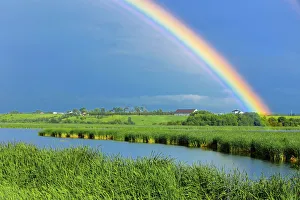 Images Dated 6th July 2009: Canada, Quebec, St. Gedeon. Rainbow and barn after storm