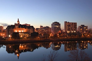 Saskatoon Prints: Canada-Saskatchewan-Saskatoon: City Skyline from the S. Saskatchewan River Evening
