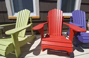Images Dated 2029: Canada St Martins New Brunswick colorful home with colorful Adirondack chairs on porch