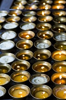 Burning Prints: Candles burning in the Chimi Lhakhang moastery, Bhutan