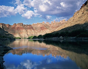 CANYONLANDS NATIONAL PARK, UTAH. USA. Colorado River & canyon walls at sunrise. Spires