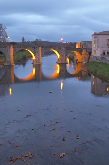 Images Dated 10th December 2006: Carcassonne. Languedoc. The old bridge across the Aude river. Illuminated in early morning