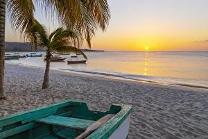 Away From It All Prints: Caribbean, Grenada, Grenadines. Sunset and wooden fishing boat on Grand Anse Beach