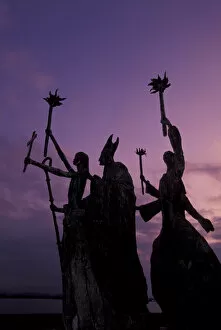 Images Dated 6th November 2003: CARIBBEAN, Puerto Rico Slender statues on coatline at dusk