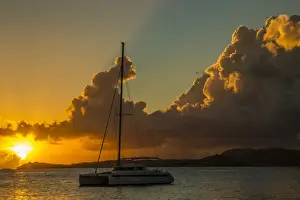 Images Dated 14th November 2013: Caribbean, USA Virgin Islands. Sailboat moored in Frank Bay at sunset. Credit as