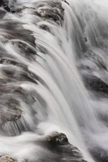 Cascading Firehole River and clouds, Yellowstone National Park, Wyoming