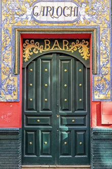 Advertising Prints: Casco Antiguo, Seville, Andalusia, Spain. Door of the Bar Garlochi. (Editorial Use Only)
