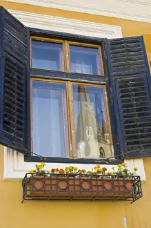 Evangelical Church Prints: The Cathedral Tower of the Evangelical Church reflecting in a window, Sibiu, Romania