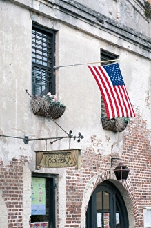Images Dated 8th April 2010: Charleston, South Carolina, USA. An American flag waves in the breeze outside a historic
