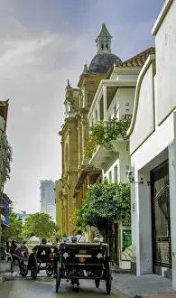 Old City Prints: Charming horse-drawn carriages take visitors for tours of historic Cartagena, Colombia