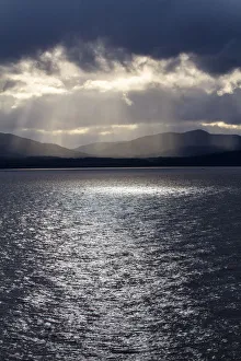 Sunray Prints: Chile, Patagonia, Strait of Magellan. Tierra del Fuego, rays of sunshine over the fjords