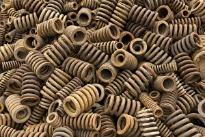 Industry Prints: China, Chongqing, Detail of heavy iron springs recycled from trucks and machinery