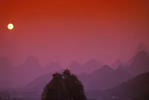 Guangxi Prints: China, Guangxi. Guilin, Solitary beauty peaks & mountains: sunset pink