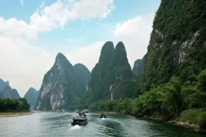 Chinese Prints: China, Guilin, Li River, River boats line the way along the River with its dramatic mountains