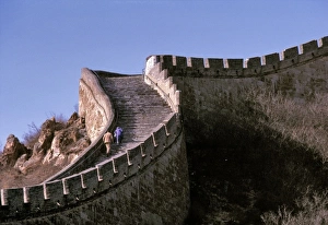 China, Hebei Province, Badaling, The Great Wall. Visitors climb the steep stairs