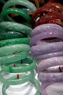 Expensive Prints: China, Hong Kong. Kansu Jade Market. Colorful carved jade bracelets