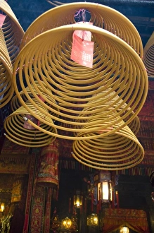 Orient Prints: China, Hong Kong, New Territories, Tai Po area. Man Mo Temple. Large coils of burning