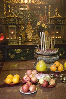 Images Dated 5th April 2009: China, Hong Kong, New Territories, Tai Po area. Inside the famous Man Mo Temple, offerings