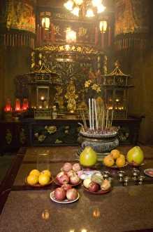 Images Dated 5th April 2009: China, Hong Kong, New Territories, Tai Po area. Inside the famous Man Mo Temple, offerings