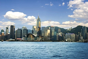 China; Hong Kong; Victoria Harbour; Harbor; A Chinese junk sails along the coast China; Hong Kong; Victoria Harbour; Harbor; A Chinese junk sails along the coast
