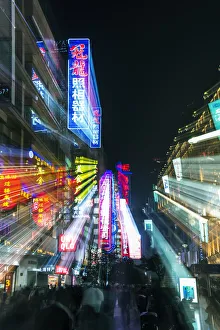 Cityscape Prints: China, Shanghai. Nanjing Road, neon sign blur
