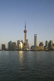Images Dated 9th February 2008: CHINA, Shanghai. Pudong District-Buildings of Pudong from the Huangpu River / Dusk