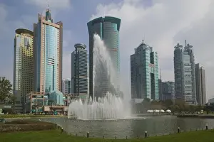 Images Dated 7th February 2008: CHINA, Shanghai. Pudong District- Pudong Highrises from Lujiazui Park Greenspace