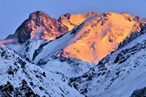 Tien Shan Prints: China, Xinjiang, Bogda Peak. Dawns red light creeps over Bogda Peak