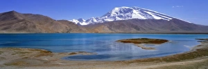 Xinjiang Prints: China, Xinjiang, Kalakuli Lake. Kalakuli Lake reflects snow-covered Mustagata Peak