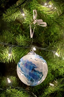 Festive Prints: Christmas ornament and lights on an artificial tree