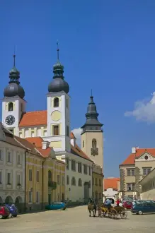 Church and castle in Old town square surrounded by 16th-century Renaissance houses